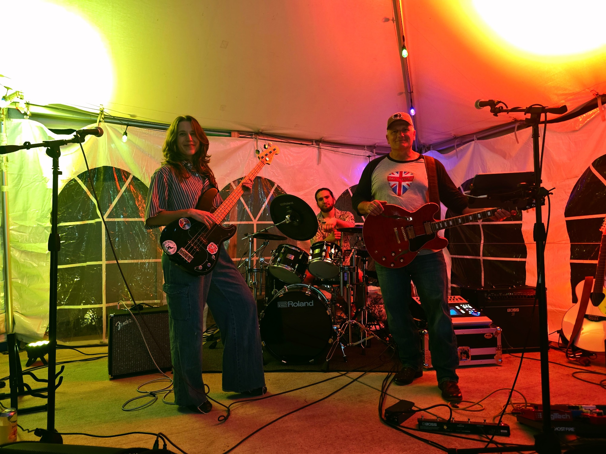 The Serendipity Band performing under stage lighting
